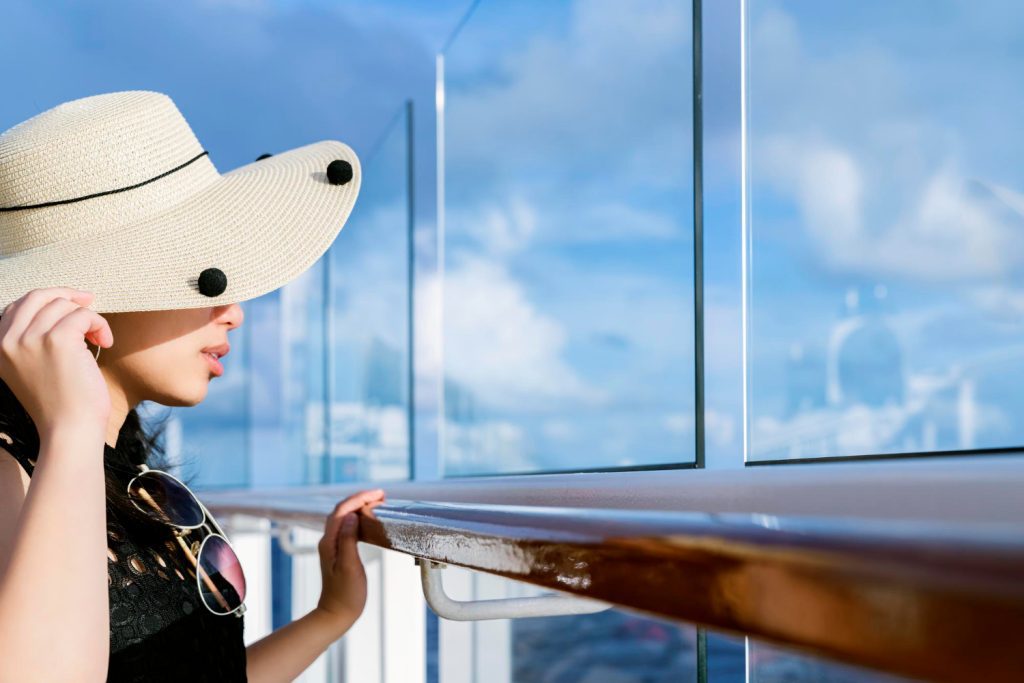attractive-carefree-asian-female-woman-casual-cloth-smile-relax-pleasure-vacation-time-cruise-ship-balcony-with-blue-sky-cloud-background (1)